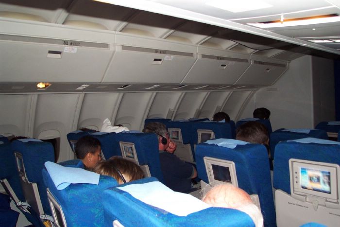 Here's a better look at the cabin in the upper deck where I was seated. I troubled passengers momentarily with flash to catch this picture. Altough off camera to the left, the gentleman across from me just glared for a moment before returning to his movie.