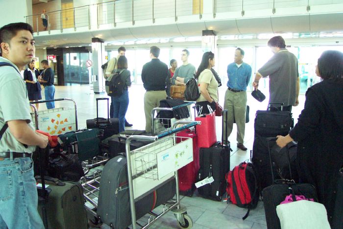 We stand around and chat while a couple members of the group are off to rent cell phones.