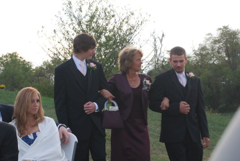 Kathy is escorted by her sons Ryan and Bob